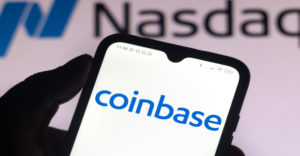 In this photo illustration, the Coinbase logo seen displayed