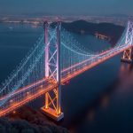 Photorealistic cross-chain bridge with a WMTX minting alert, Bitso paused trading, Ethereum glow, SingularityNET symbol.
