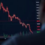 Crypto trader analyzes Solana chart with two bearish crossovers and SOL logo on screen