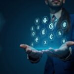 Fintech executive before a holographic display of 18 fiat currencies and crypto icons, Bybit MyBank branding.